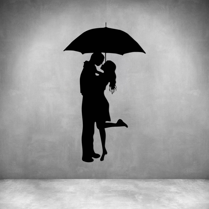 COUPLE UNDER UMBRELLA